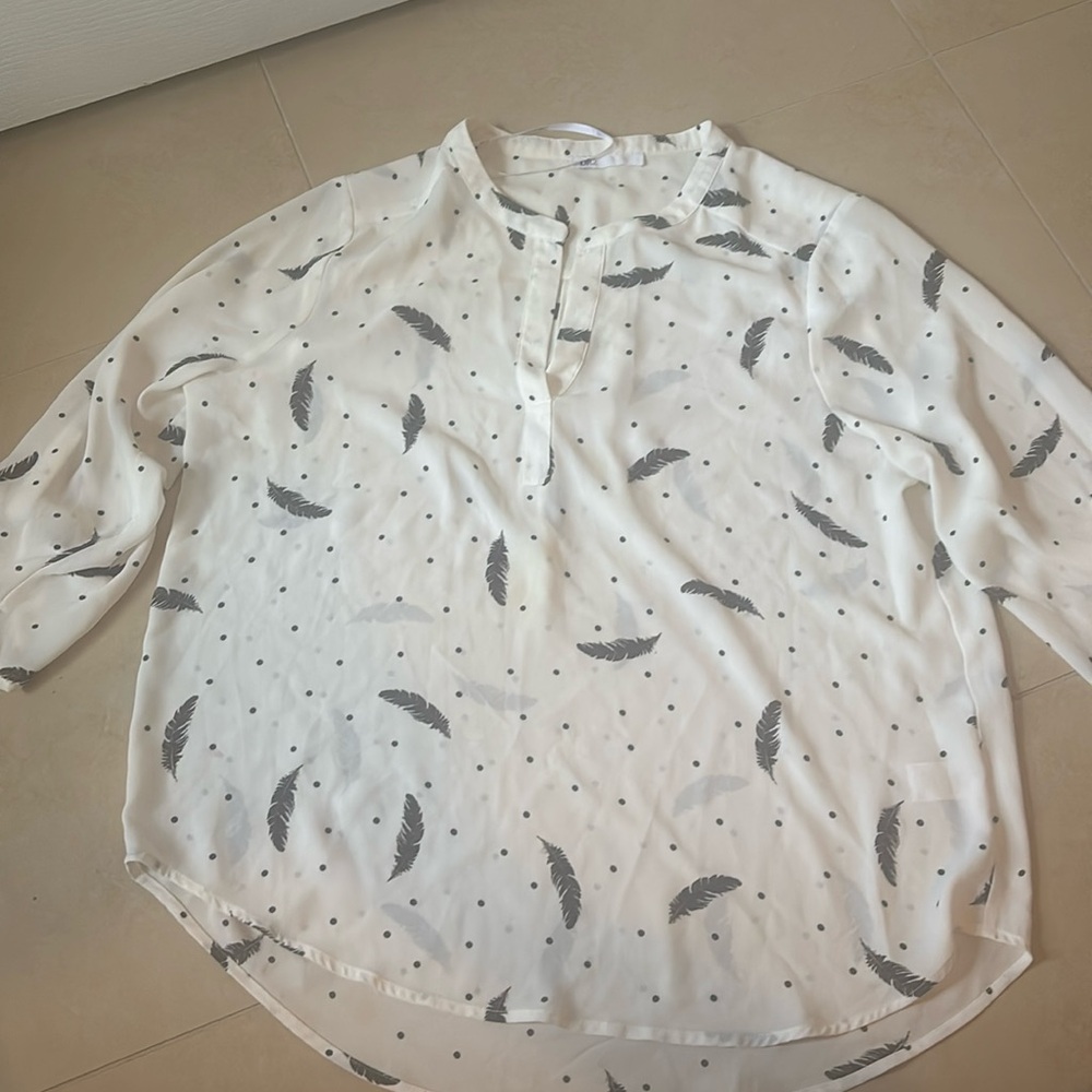 Cream blouse with black feathers size large
